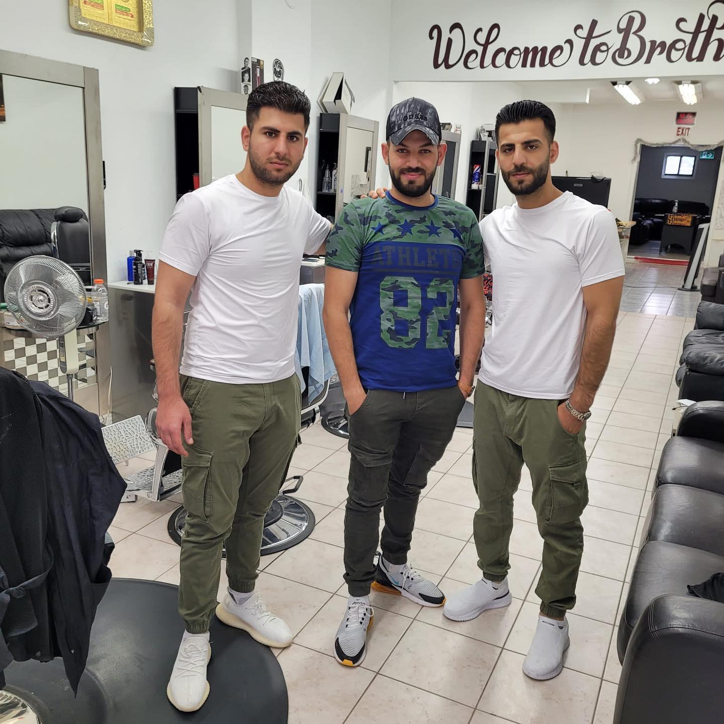 Brothers Barbershop interior and team
