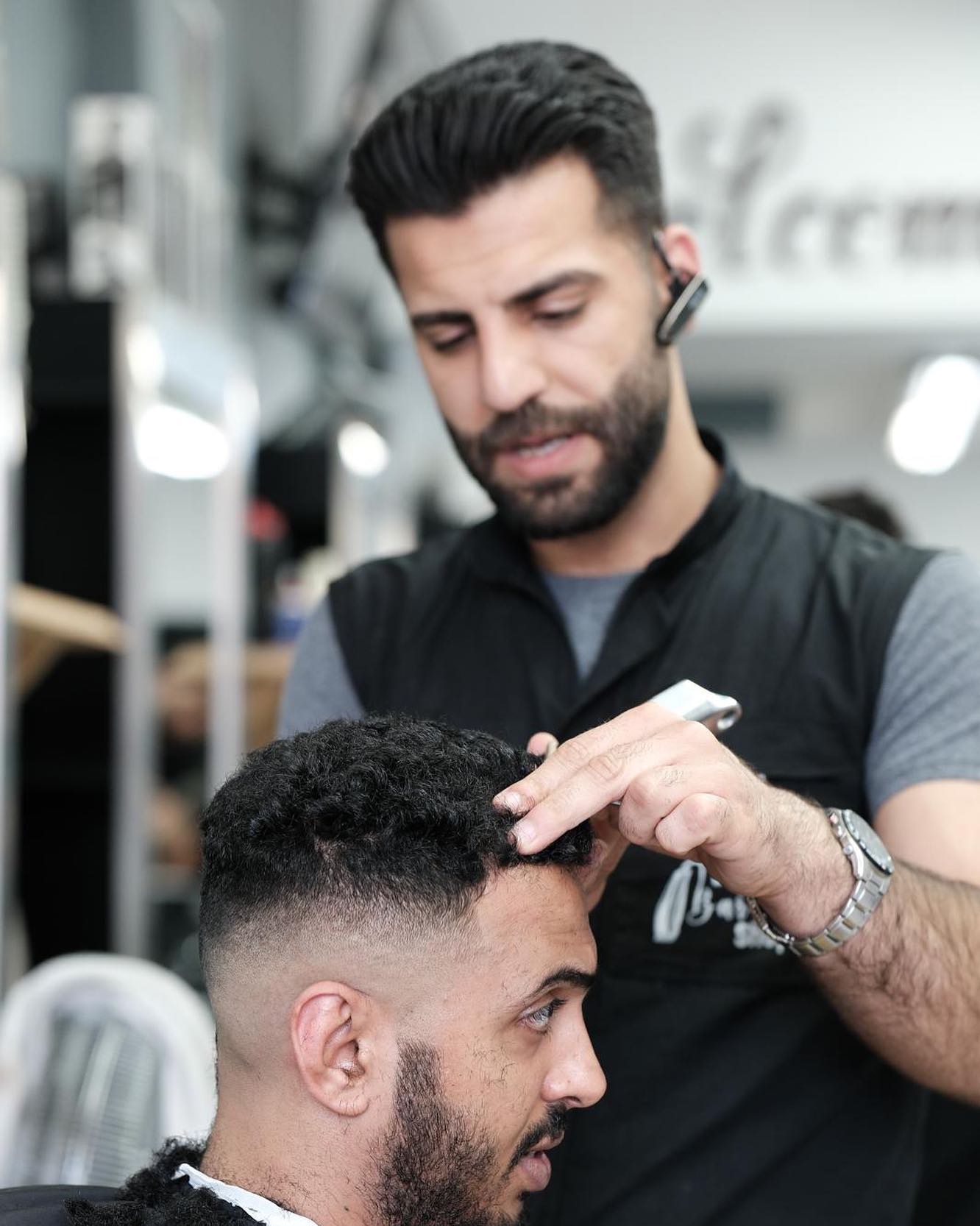 Brothers Barbershop interior and team