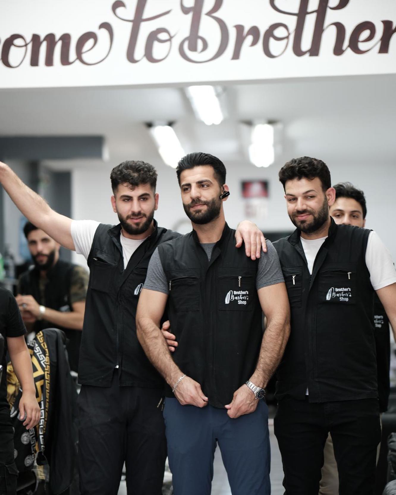 Brothers Barbershop interior and team
